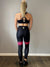 Black and pink gym leggings, high waisted with thigh high sheer legs. Front image