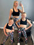 Hayley, Eden and Milan wearing matching Christmas leggings