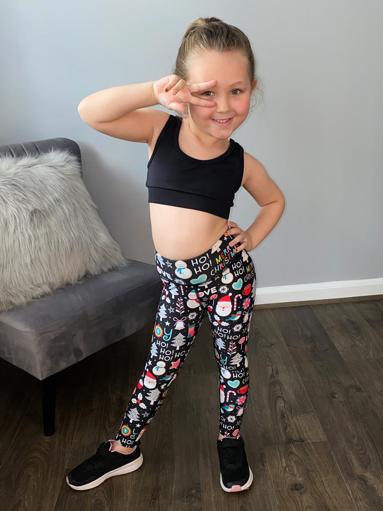 Hayley, Eden and Milan wearing matching Christmas leggings